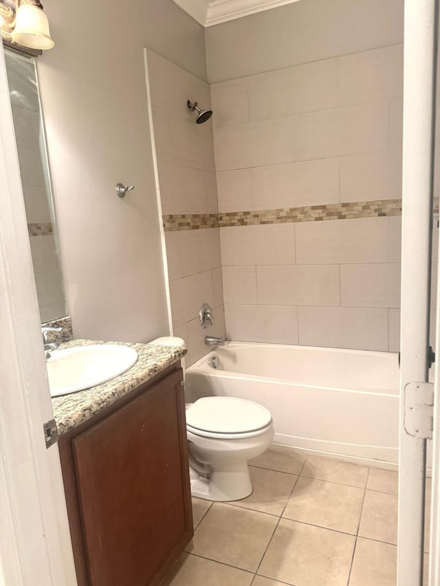 full bathroom featuring tiled shower / bath combo, vanity, ornamental molding, tile patterned floors, and toilet