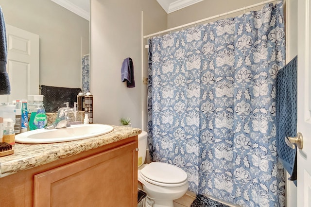 bathroom with tile patterned floors, vanity, toilet, and crown molding