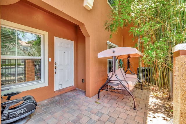 entrance to property with a patio