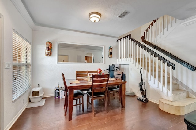 dining area featuring dark wood-type flooring