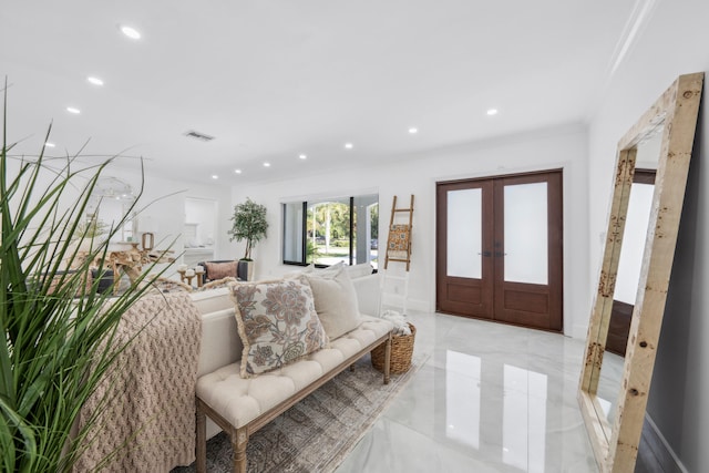 entrance foyer featuring french doors and crown molding