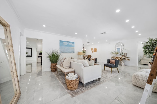 living room featuring crown molding