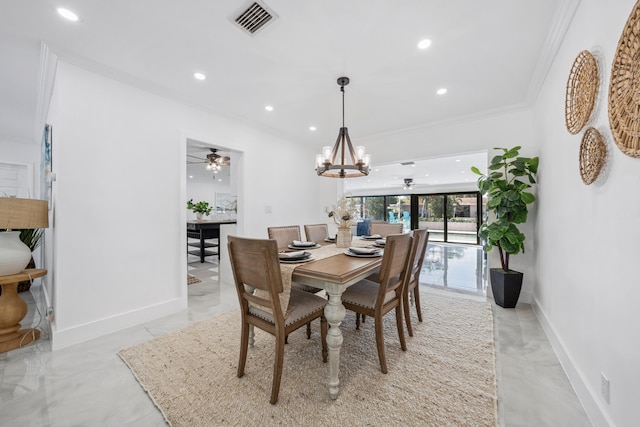 dining area featuring ceiling fan with notable chandelier and ornamental molding