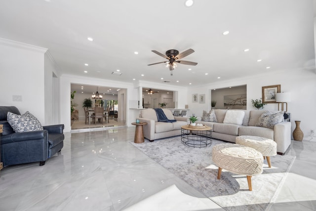 living room with crown molding and ceiling fan