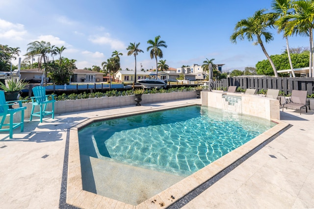 view of swimming pool with a patio area