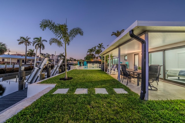 yard at dusk with a boat dock