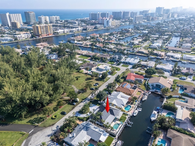 birds eye view of property with a water view