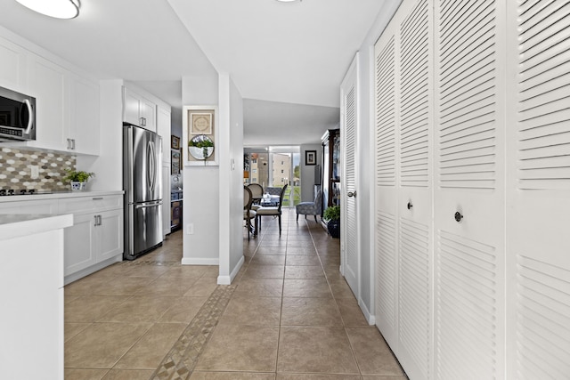 hallway featuring light tile patterned floors