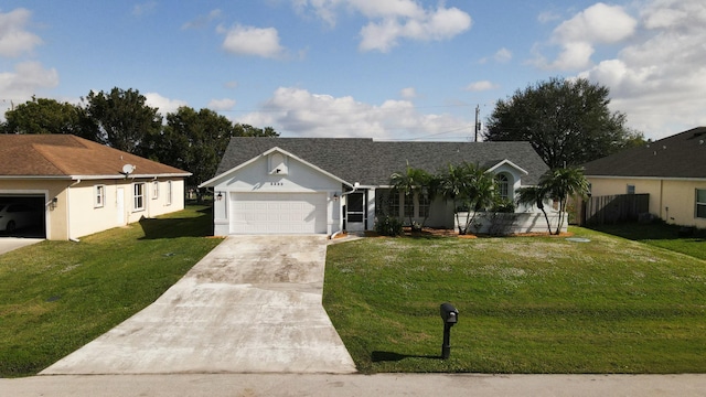 single story home featuring a garage and a front lawn