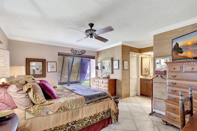 tiled bedroom featuring ceiling fan, a textured ceiling, and ornamental molding