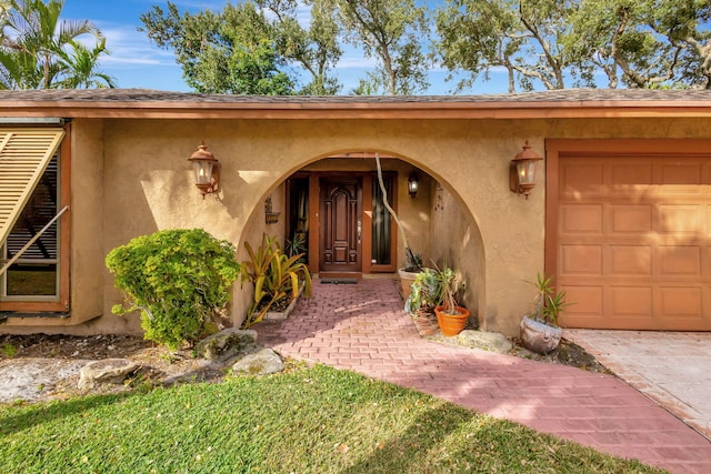 doorway to property featuring a garage