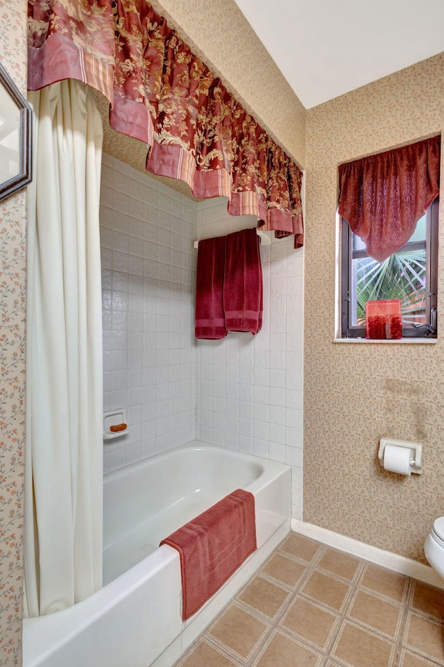 bathroom featuring a bath and toilet