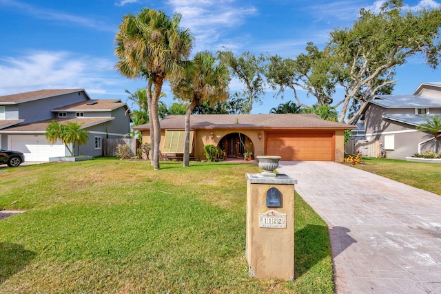 view of front facade with a front lawn and a garage