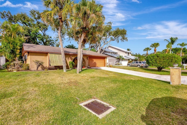 ranch-style home with a front yard and a garage