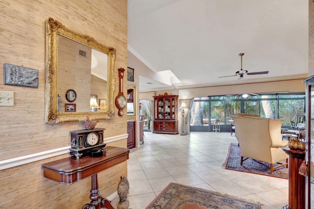 interior space with light tile patterned floors and high vaulted ceiling