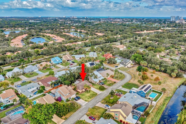 birds eye view of property featuring a water view