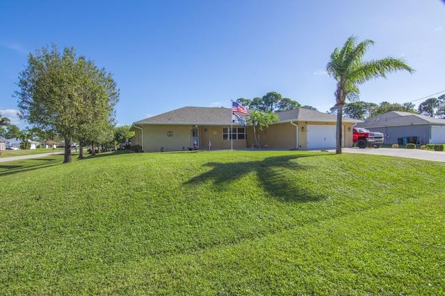 ranch-style home with a front yard and a garage