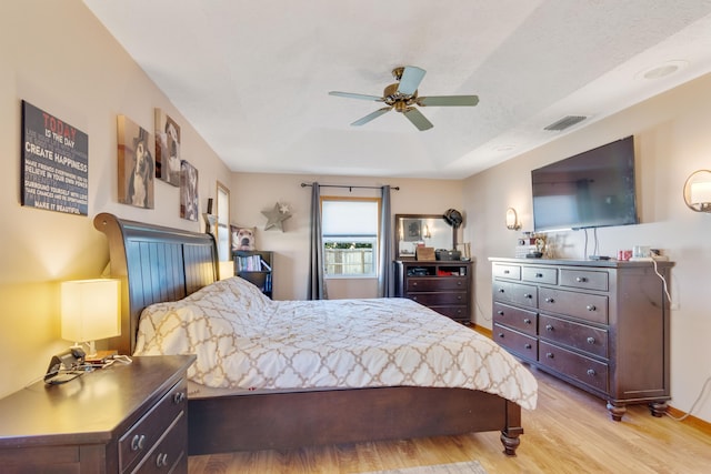 bedroom featuring ceiling fan and light hardwood / wood-style flooring