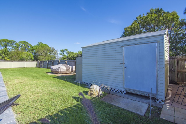 view of outdoor structure with a yard