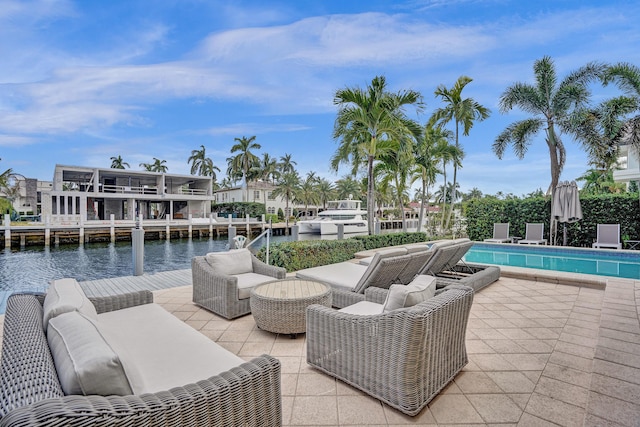 view of patio featuring outdoor lounge area and a water view