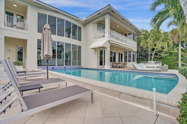 exterior space with a balcony and a patio