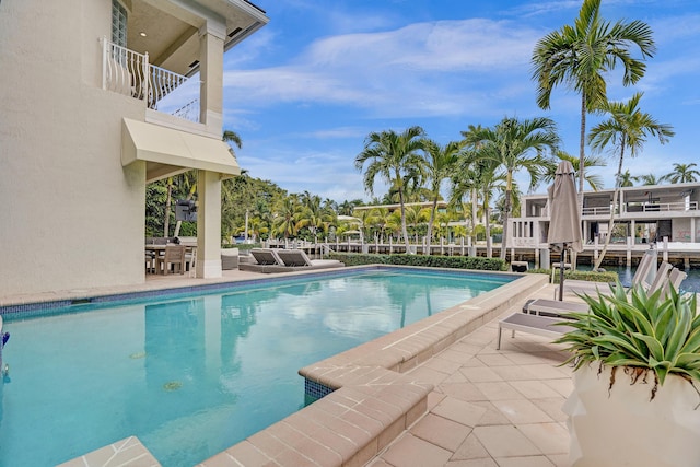 view of swimming pool with a patio