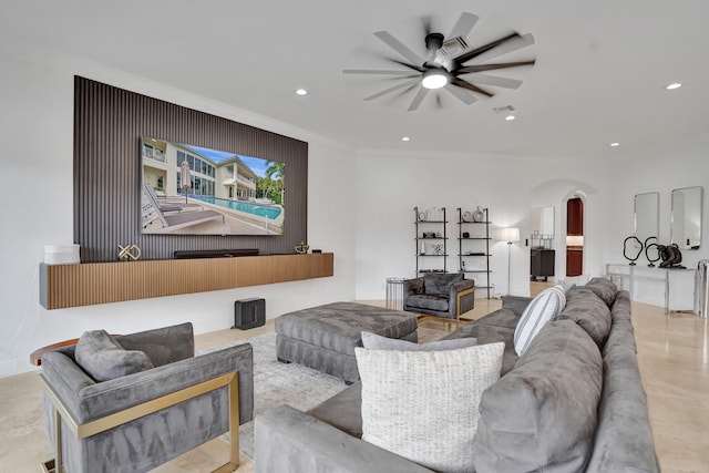 living room with ceiling fan and ornamental molding