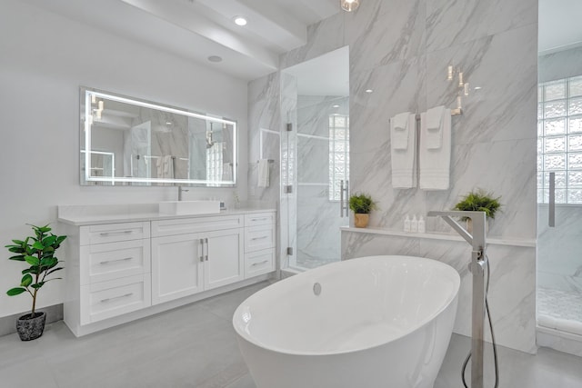 bathroom with vanity, tile patterned floors, and tile walls