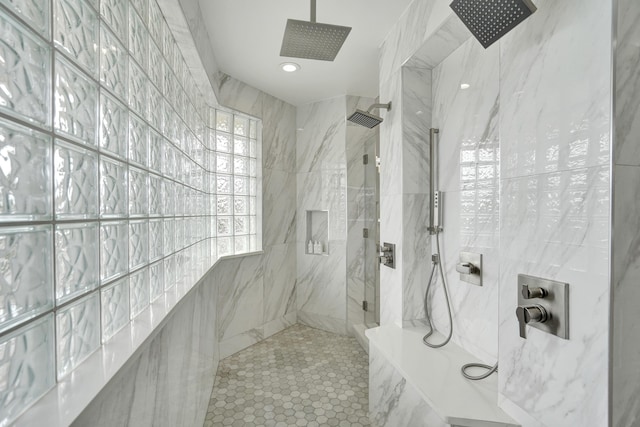 bathroom with a tile shower