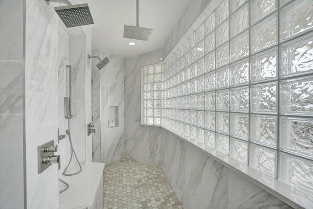 bathroom featuring a tile shower