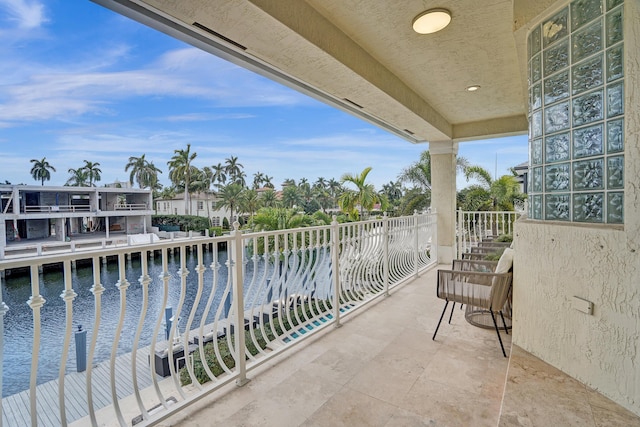 balcony featuring a water view