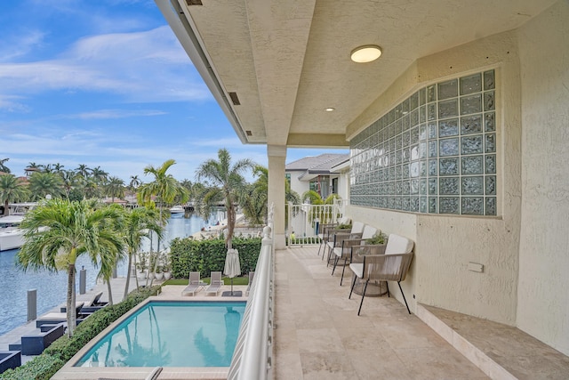 view of pool with a water view