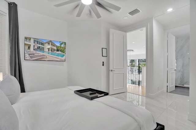 bedroom featuring ensuite bath and ceiling fan