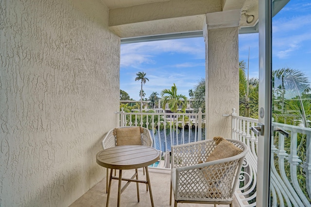 balcony featuring a water view