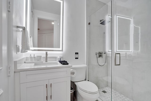 bathroom with vanity, toilet, and walk in shower