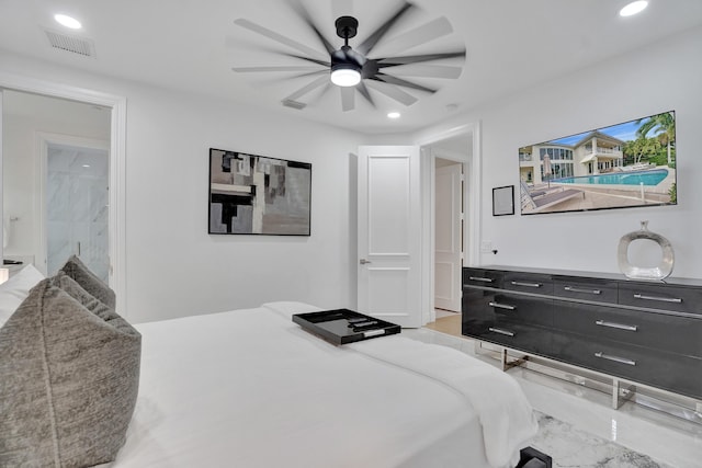 bedroom featuring ensuite bathroom and ceiling fan