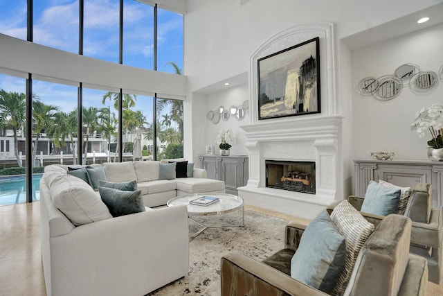 living room featuring a towering ceiling