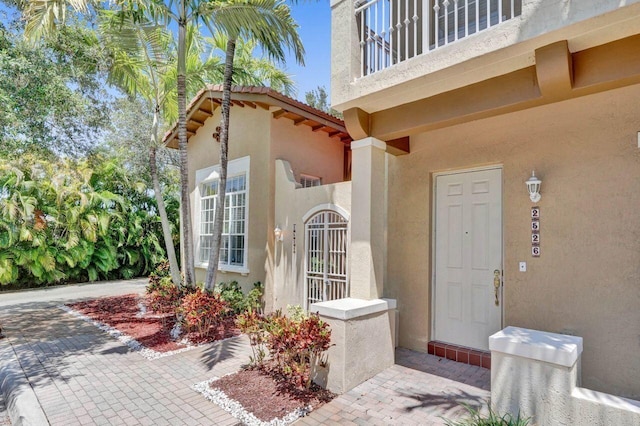 doorway to property featuring a balcony