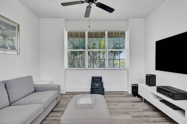 living room with light hardwood / wood-style floors, plenty of natural light, and ceiling fan