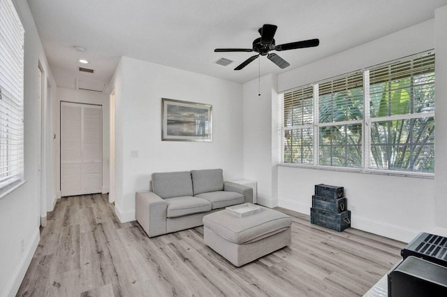 unfurnished living room with ceiling fan and light hardwood / wood-style floors