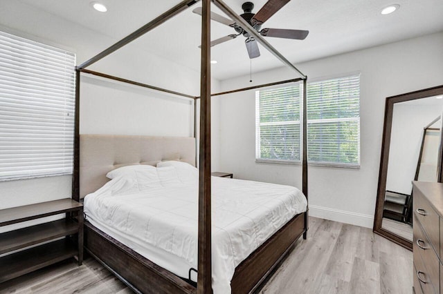 bedroom featuring ceiling fan and light hardwood / wood-style floors