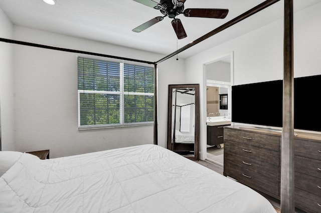 bedroom with ensuite bathroom and ceiling fan