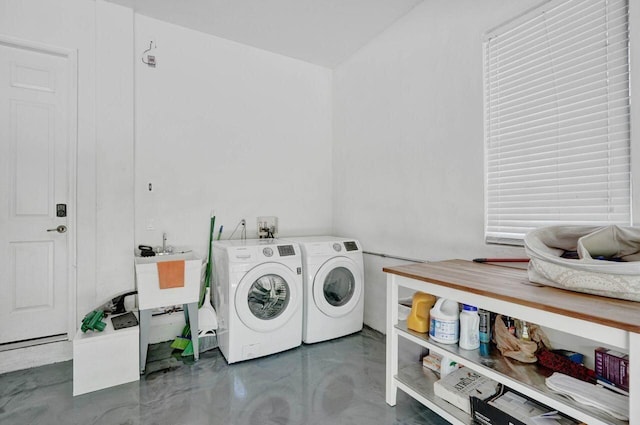 clothes washing area featuring washing machine and dryer