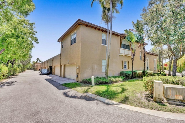 view of property exterior with a garage