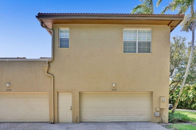 view of side of property featuring a garage