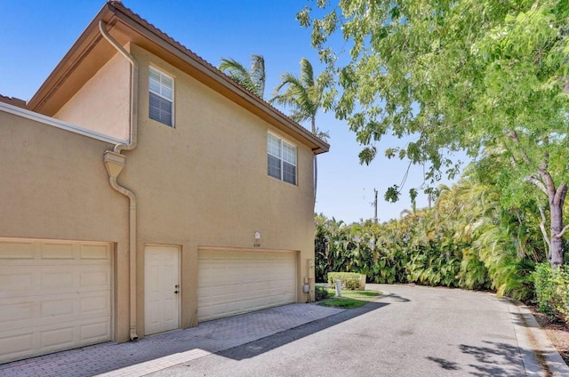 view of property exterior with a garage