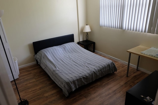 bedroom featuring dark hardwood / wood-style flooring