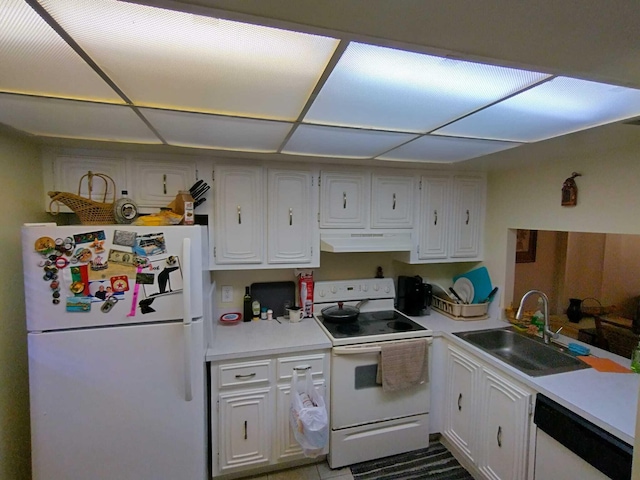 kitchen featuring white appliances, white cabinetry, and sink