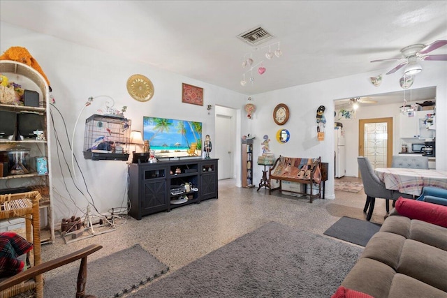 living room featuring ceiling fan