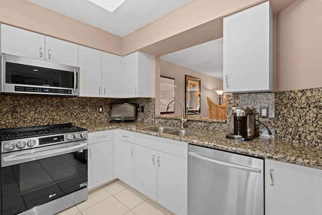 kitchen featuring white cabinetry, sink, and appliances with stainless steel finishes